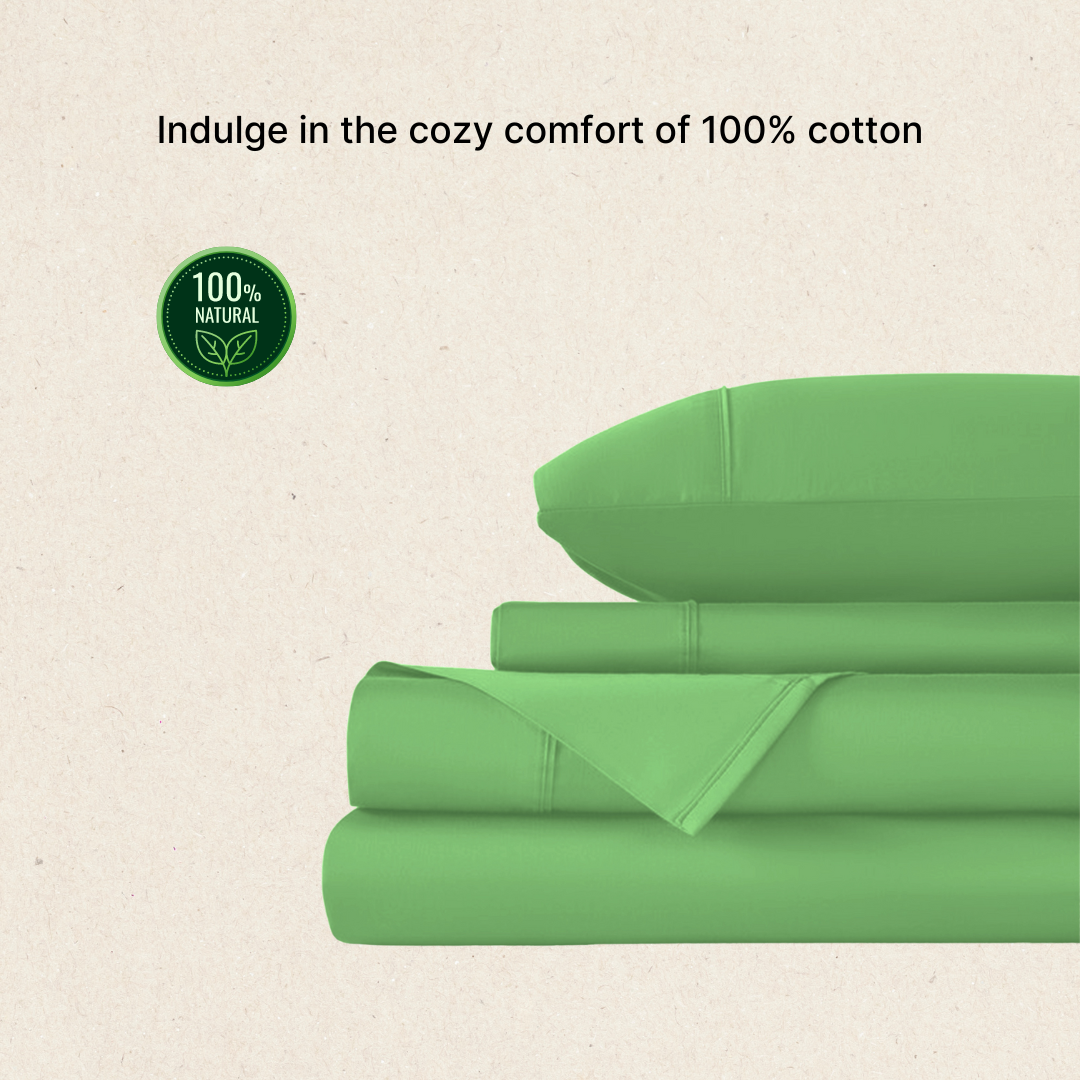 Cozy green 100% Egyptian cotton bed sheets neatly stacked with a pillow on top. 300 thread count, queen size.