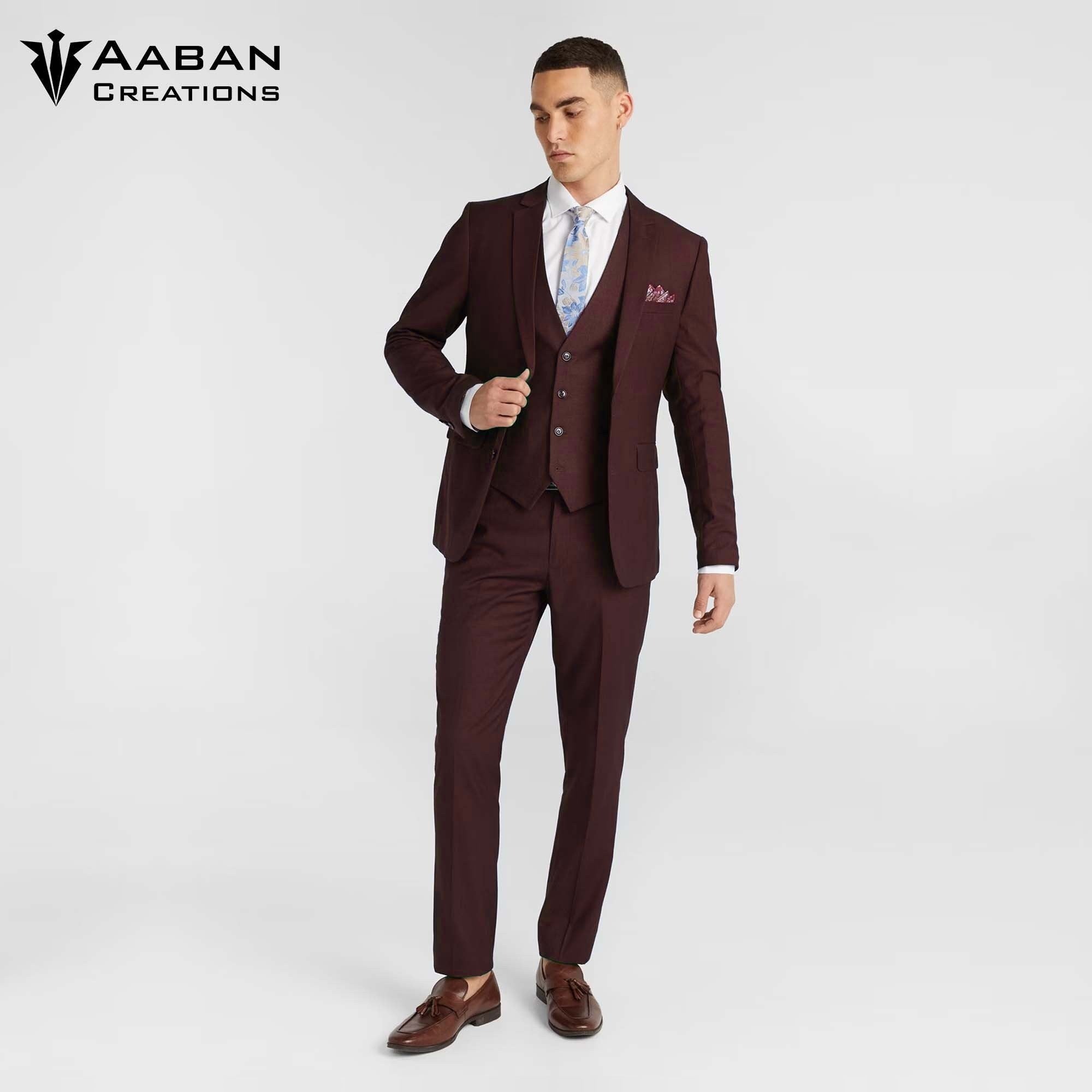 A man in a slim-fit, crater brown, two-piece suit. Perfect for business, formal events, or special occasions, this custom-made suit offers a luxurious and impressive look.