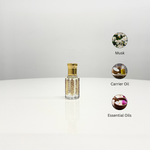 A bottle of Musk Attar Unisex perfume with a decorative gold and red design. This unisex fragrance features a blend of musk, carrier oils, and essential oils.