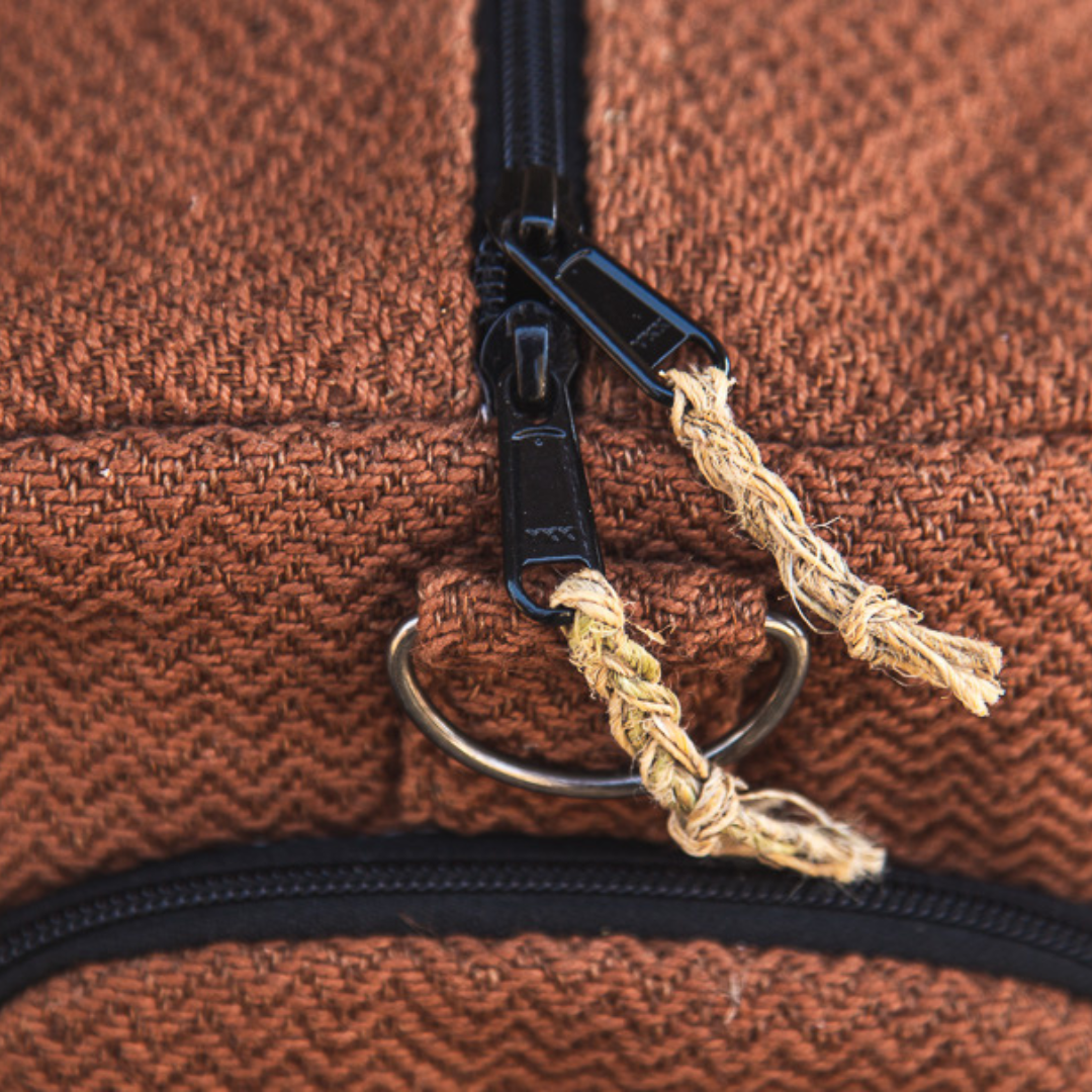 Close-up of the durable, hemp zipper on a brown Eco-friendly Hemp Duffle Bag with Shoe Pocket.