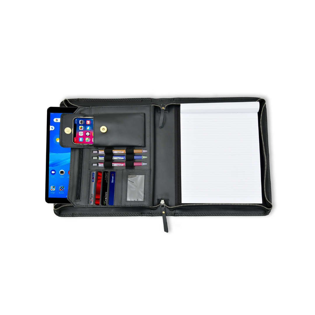 Black leather business portfolio organizer open and laid flat, displaying slots for a tablet, notepad, phone, pens, and cards.