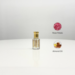 A bottle of Rose Attar Unisex perfume with ornate gold detailing. Made with rose petals and almond oil.