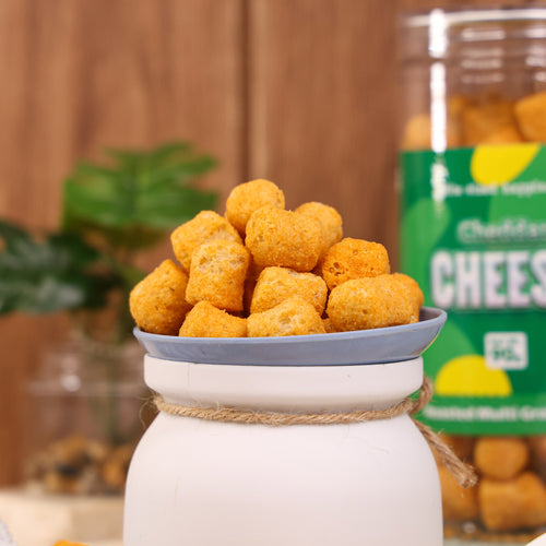 Crack A Nut's Cheddar Cheese Roasted Multi-Grain Puffs, Savory & Healthy Snack, Packed with Protein & Low in Sugar, Lightly Roasted Multi-Grain Goodness, Perfect for Cravings & Guilt-Free Indulgence, 100g.