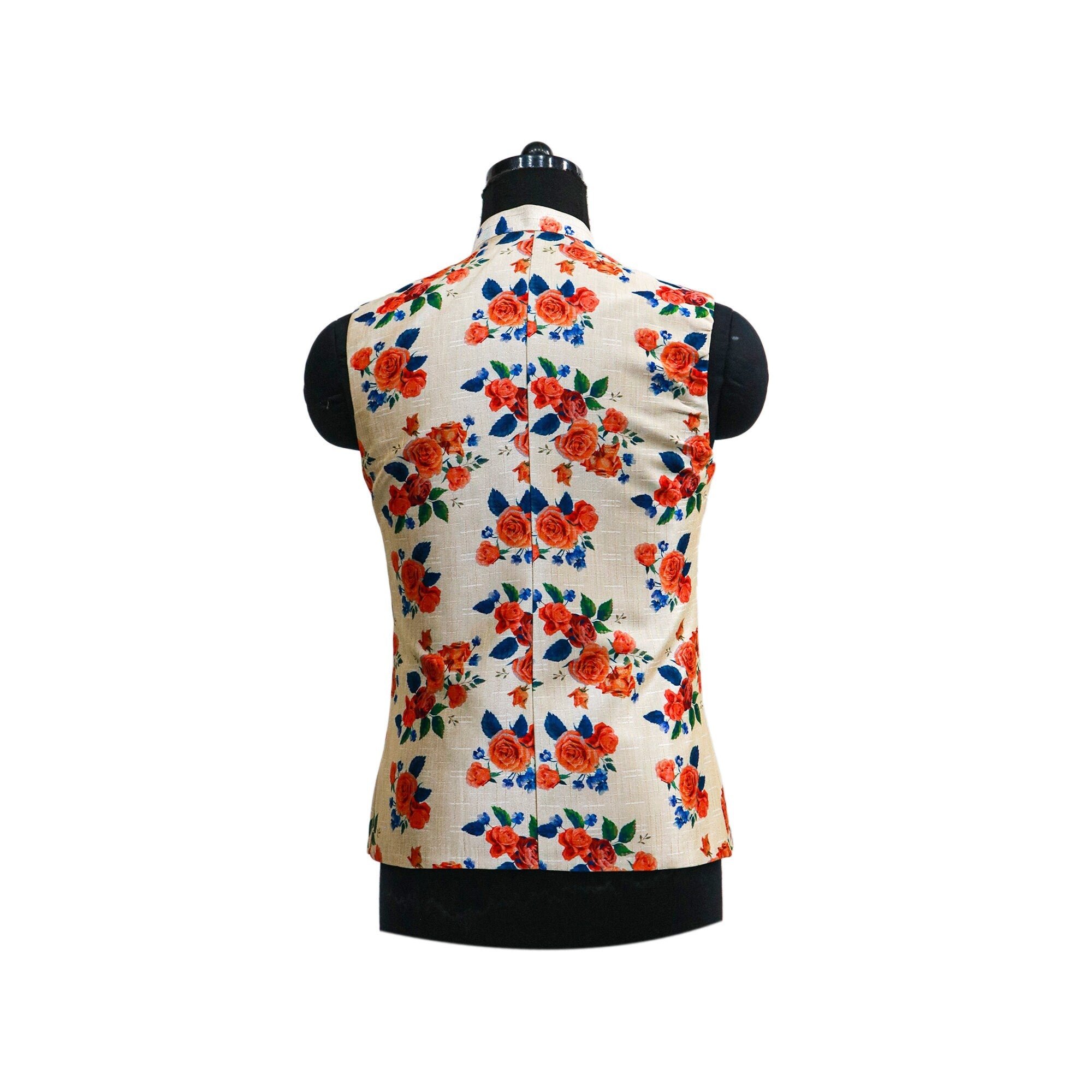 Cream colored Nehru jacket with a colorful vintage floral pattern, displayed on a mannequin.