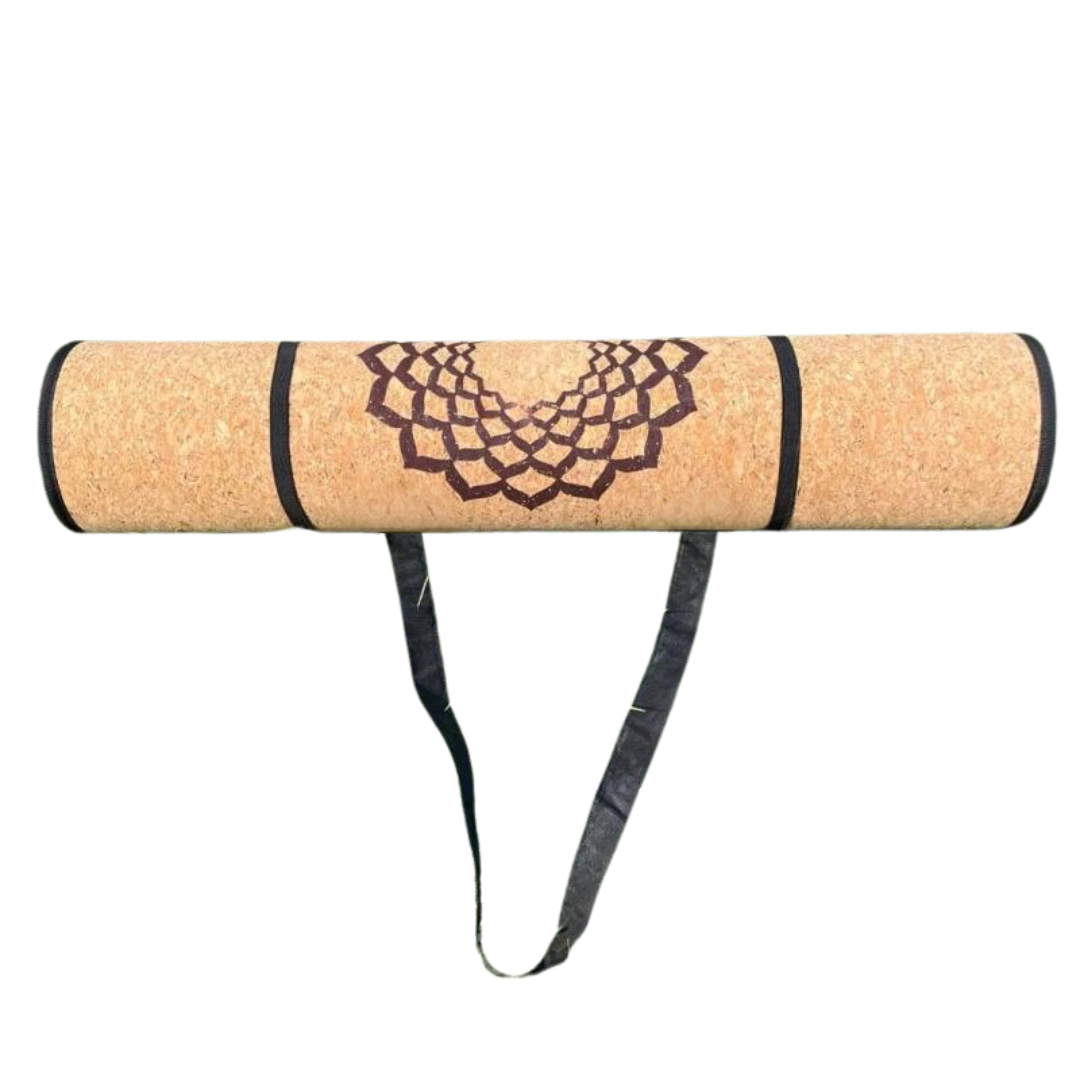 Eco-friendly cork yoga mat with a mandala design and carrying strap, providing excellent grip and durability for a balanced practice.