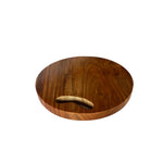 Round wooden chopping board with a carved handle, offering a non-slip grip for safe and efficient food preparation.