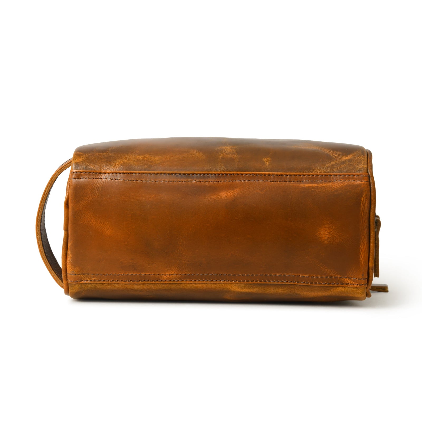 Stylish brown leather toiletry bag for men, crafted with water-resistant top grain leather and a durable double zipper closure.