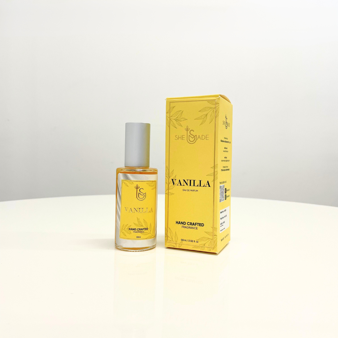 "Sweet Vanilla Perfume Unisex" in a sleek bottle beside its branded box. This handcrafted fragrance offers a warm, inviting scent for all genders.