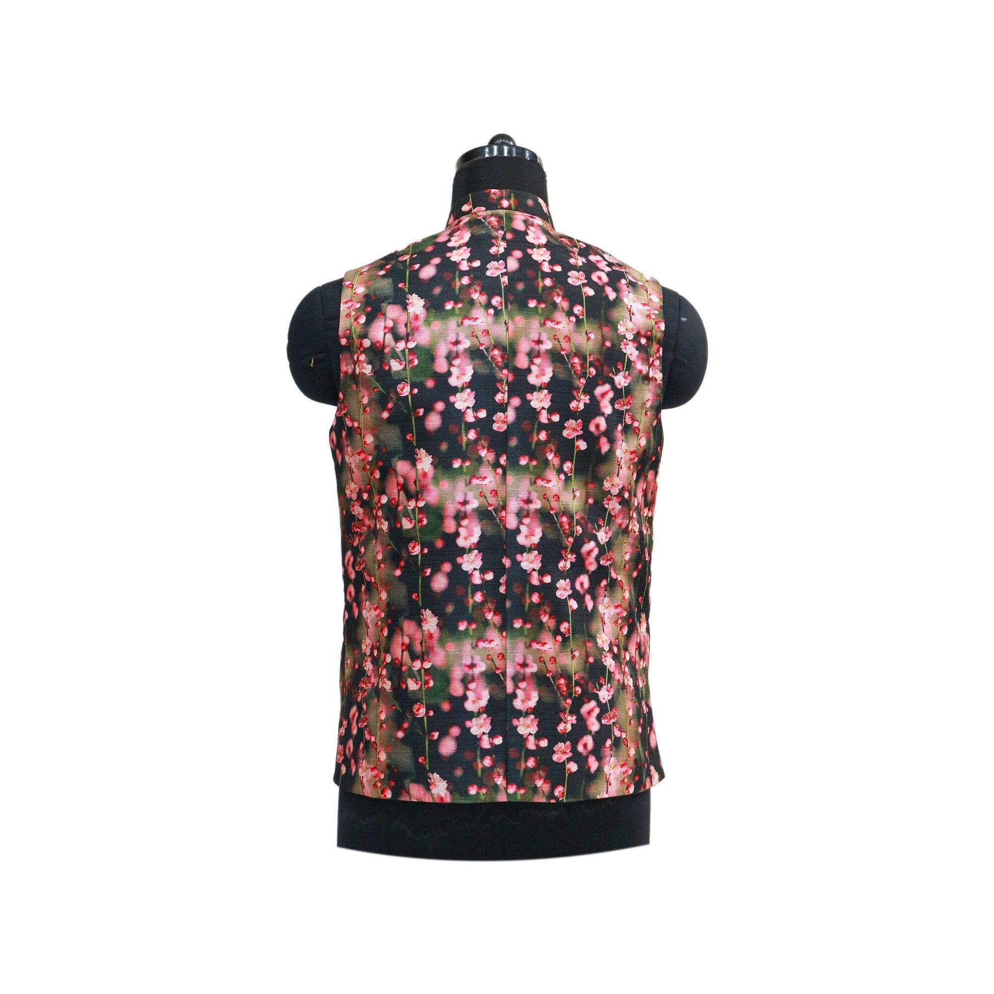 Handmade floral Nehru jacket on mannequin, back view. Features a black vest with a pink blossom pattern.