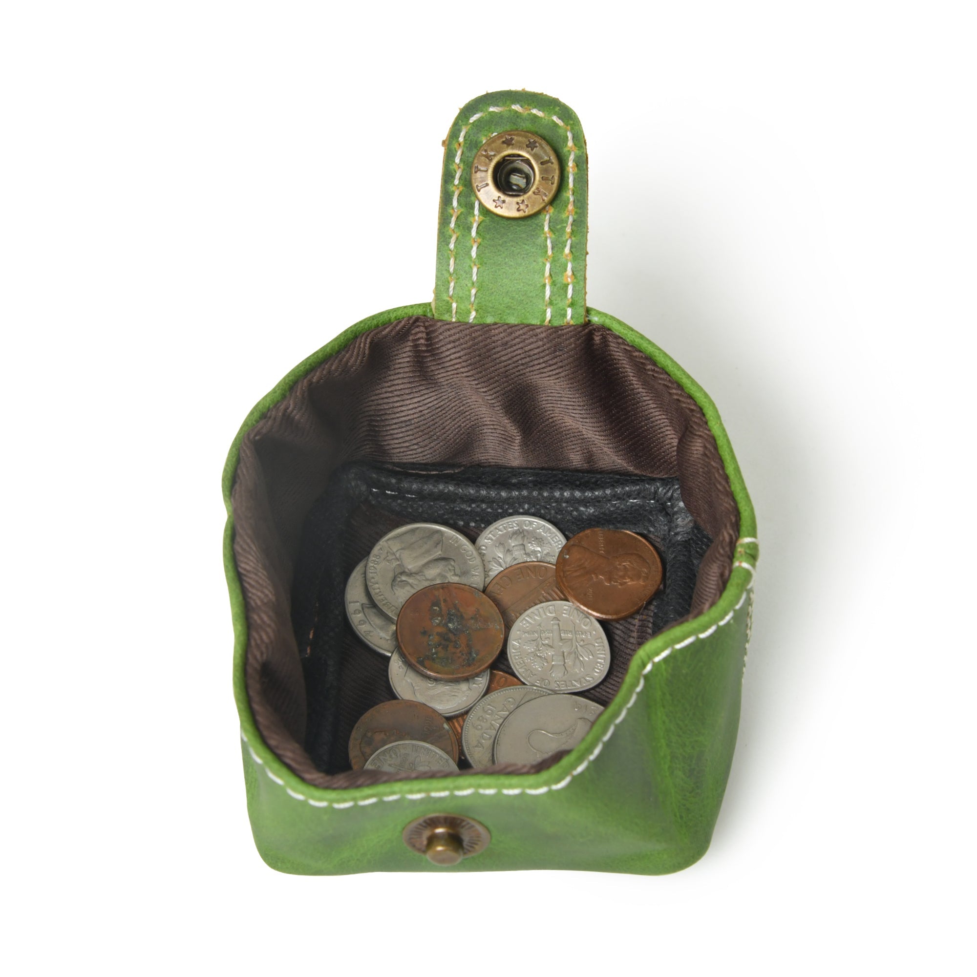 Open green leather coin pouch with snap closure, showcasing its compact size and brown lining filled with coins.