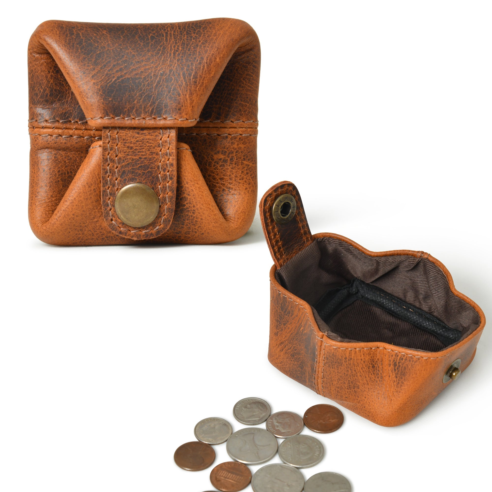 Open and closed views of a slim, vintage brown leather coin purse with a snap closure, shown with coins scattered nearby.