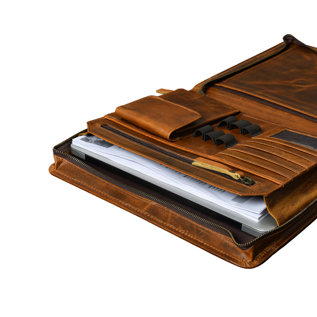 Cognac top grain leather padfolio organizer open and displaying large inside pocket with a laptop, notepad, and pen slots.