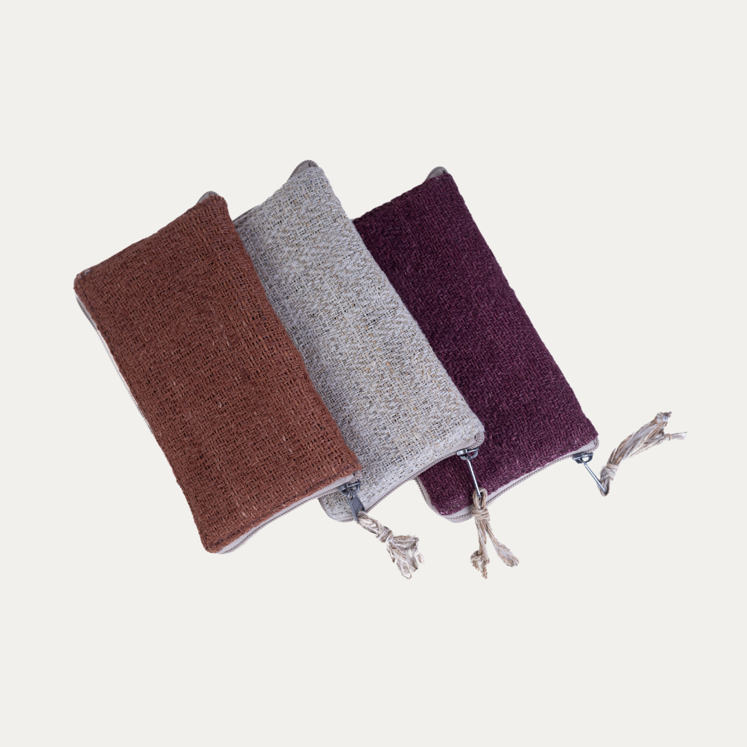 Three Compact Light Weighted Maya Hemp Clutch Wallets in a row, showcasing the brown, beige, and maroon color options.