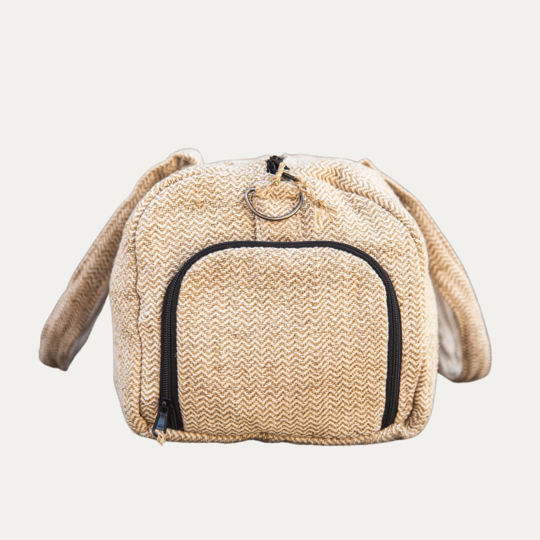 Eco-friendly hemp duffle bag in a natural beige color with a separate shoe pocket, perfect for travel or gym use.