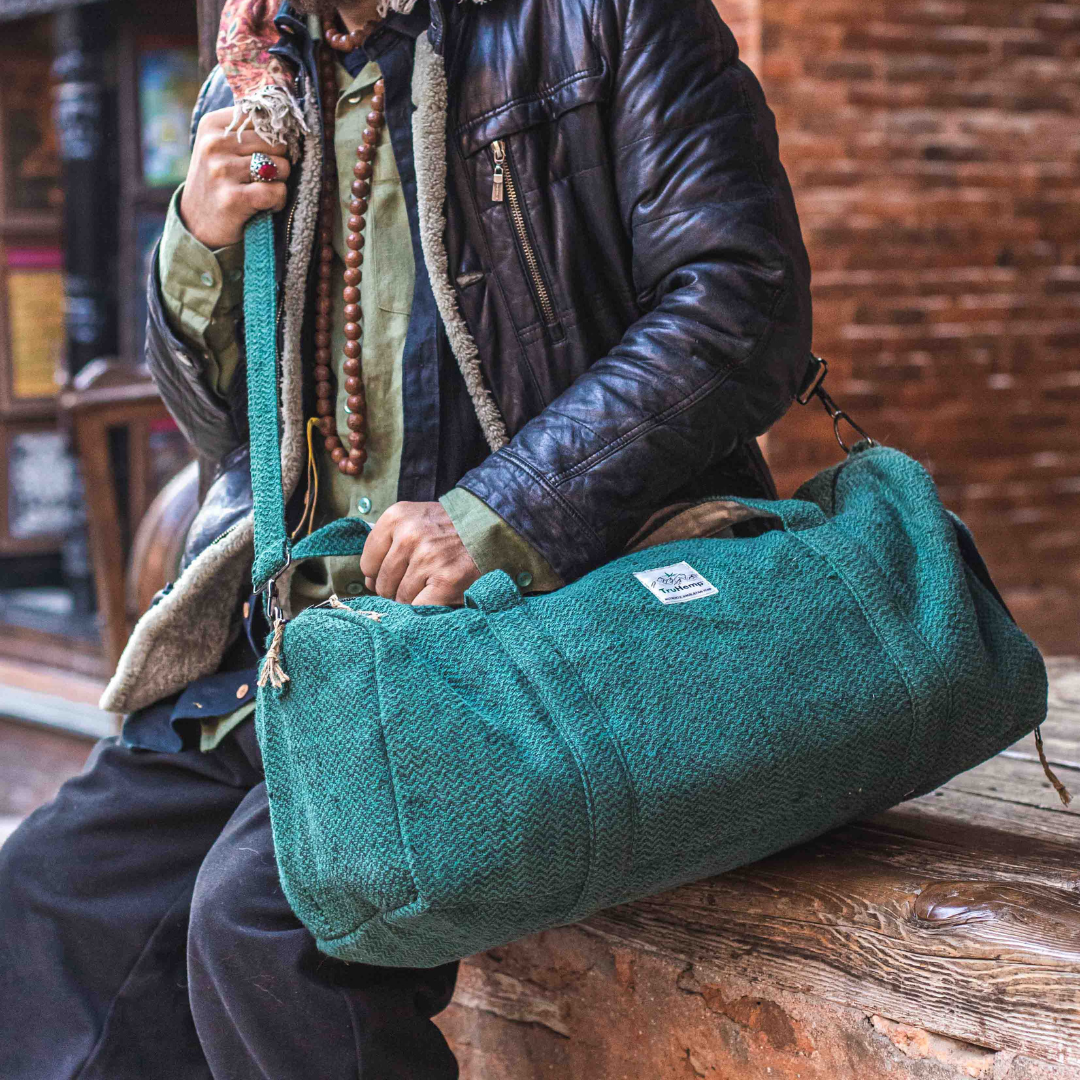 Stylish, eco-friendly hemp duffle bag in teal, featuring a spacious main compartment and a dedicated shoe pocket. Perfect for travel or the gym.