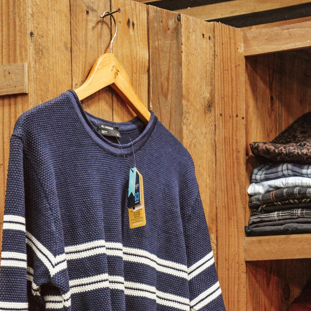 A navy blue and white striped sweater hangs on a smooth, wooden hanger. This Wooden Hanger Set is perfect for keeping clothes wrinkle-free.