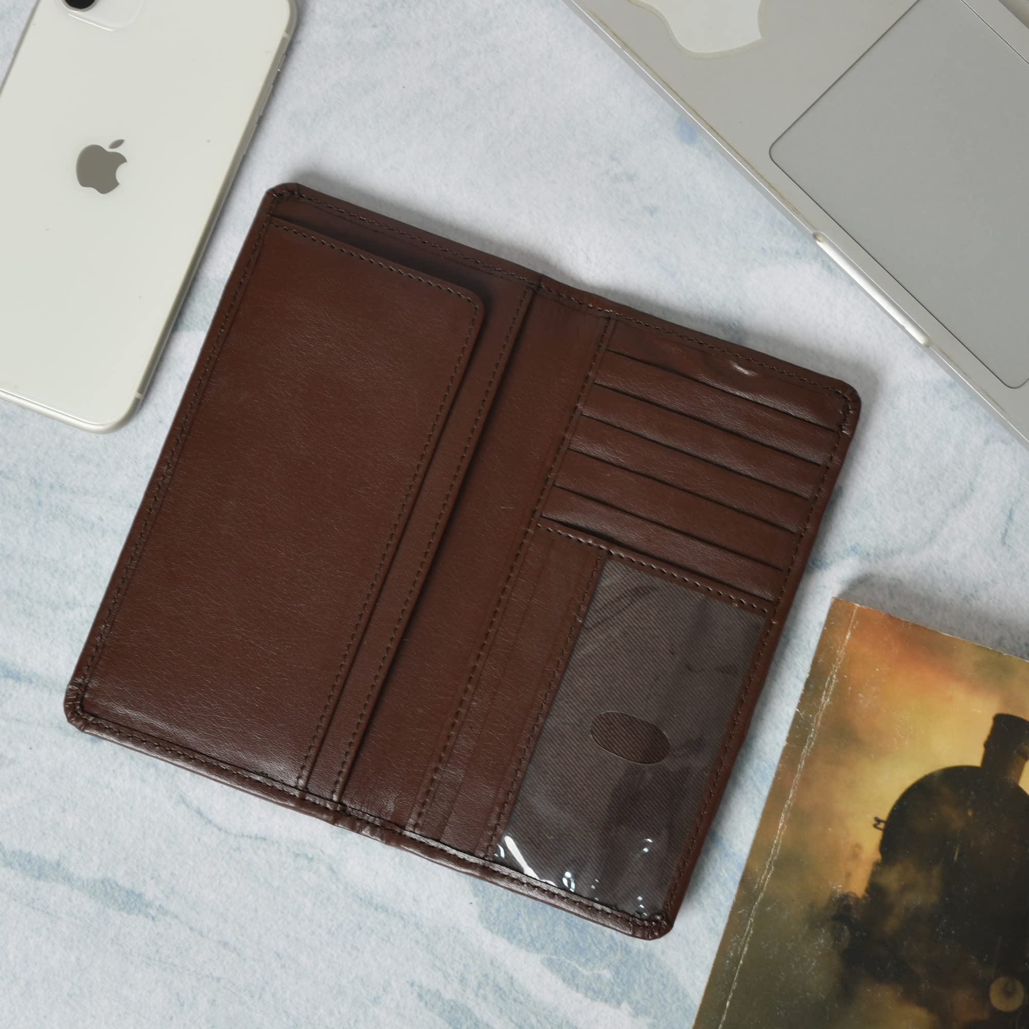 Open brown leather checkbook cover, displaying multiple card slots and a clear ID window.