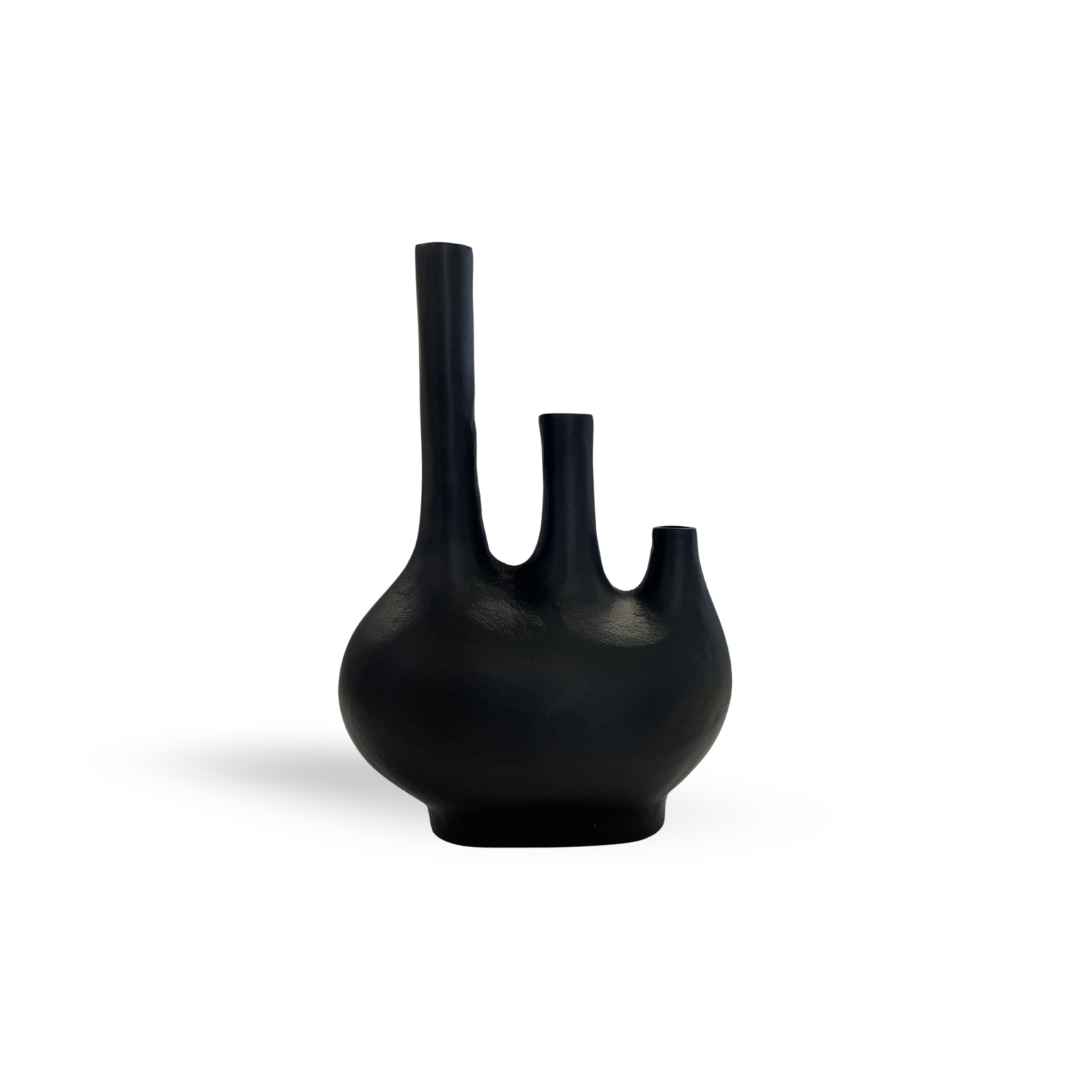 A matte black vase with three necks of varying heights, perfect for minimalist or modern decor.