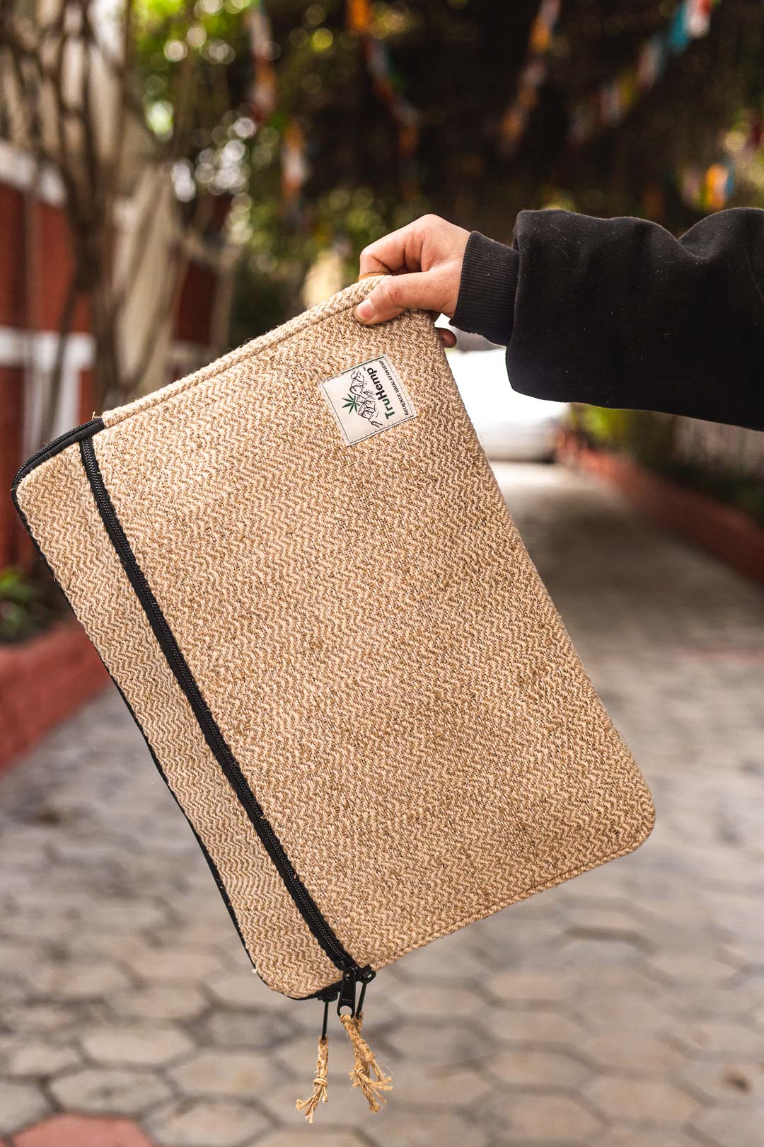 Eco-friendly Himalayan Natural Hemp Laptop Sleeve with a unique herringbone pattern and a secure zipper closure.