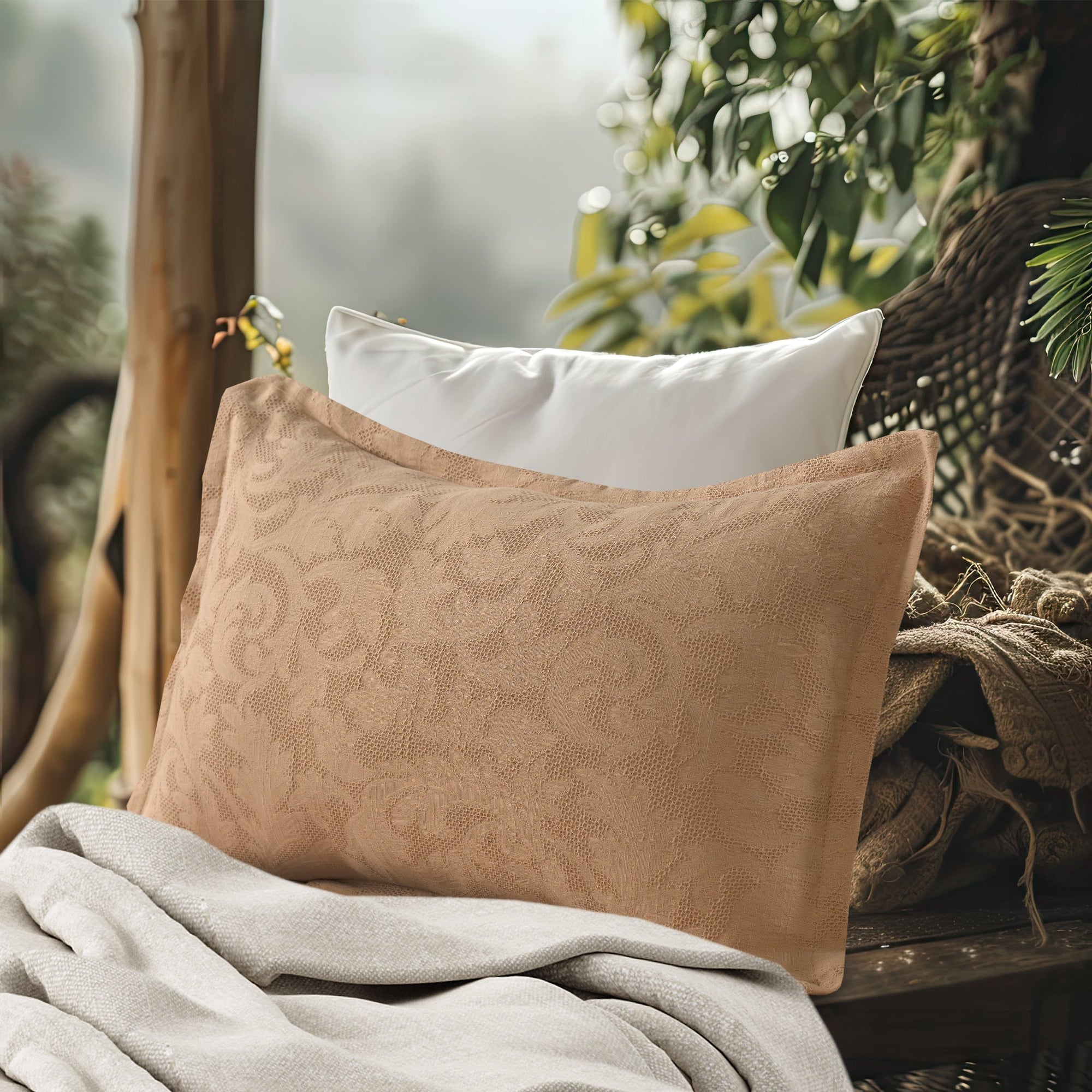 Tanned pink waffle-textured cotton pillow sham with a subtle floral design, shown on a bed with a matching blanket.