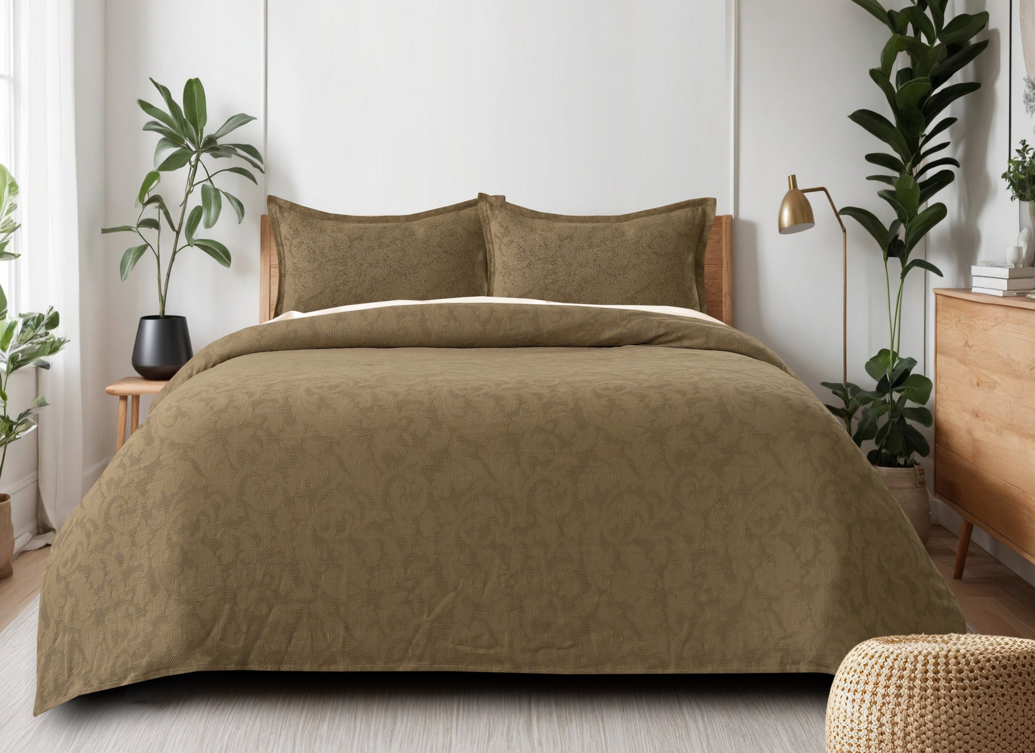 Sage green waffle-weave cotton bedsheet set with floral pattern on a queen-sized bed with two matching pillow shams.