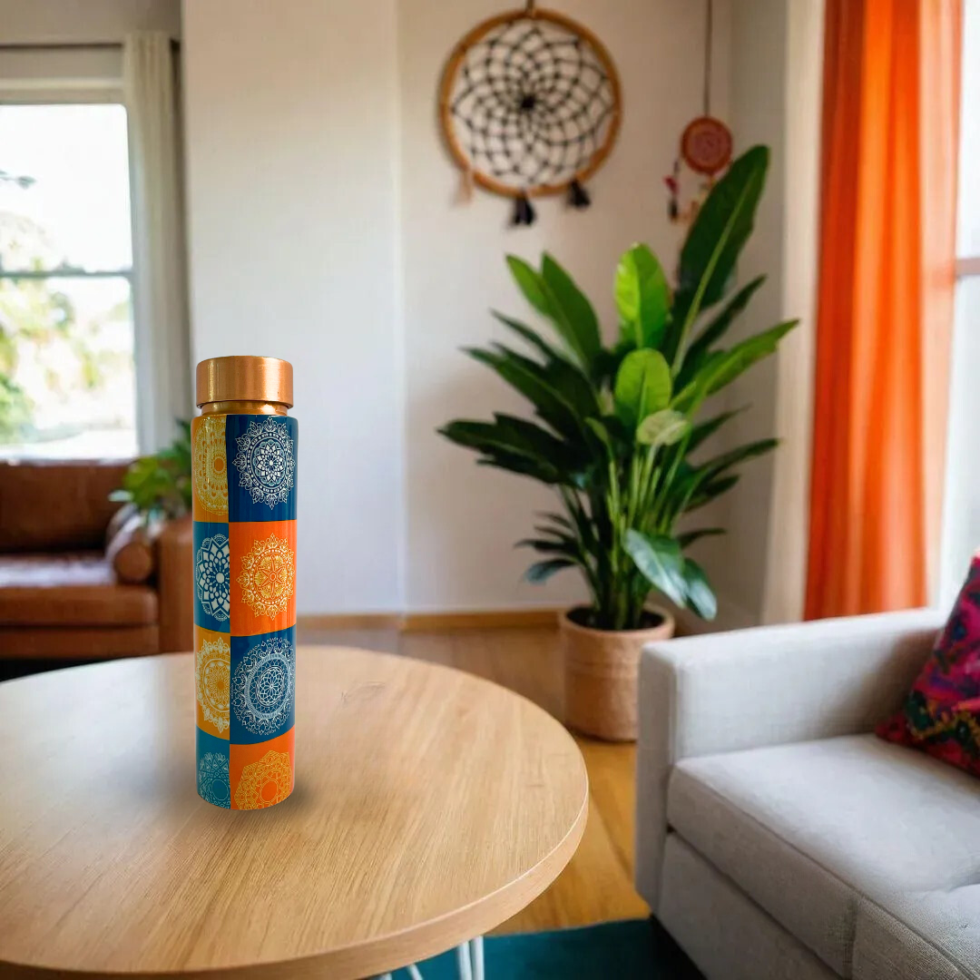 Multicolor copper water bottle with a bohemian mandala design, showcasing vibrant orange and blue hues.