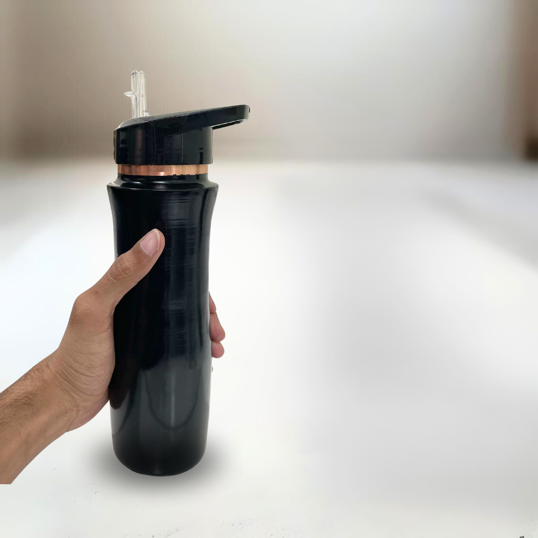 Black and copper Sports Water Bottle with built-in straw, held in a hand.