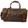 Stylish brown leather weekender duffel bag with multiple pockets, perfect for short trips.