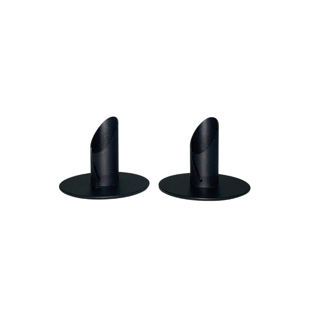 Set of two black metal candle holders with a modern, minimalist design.