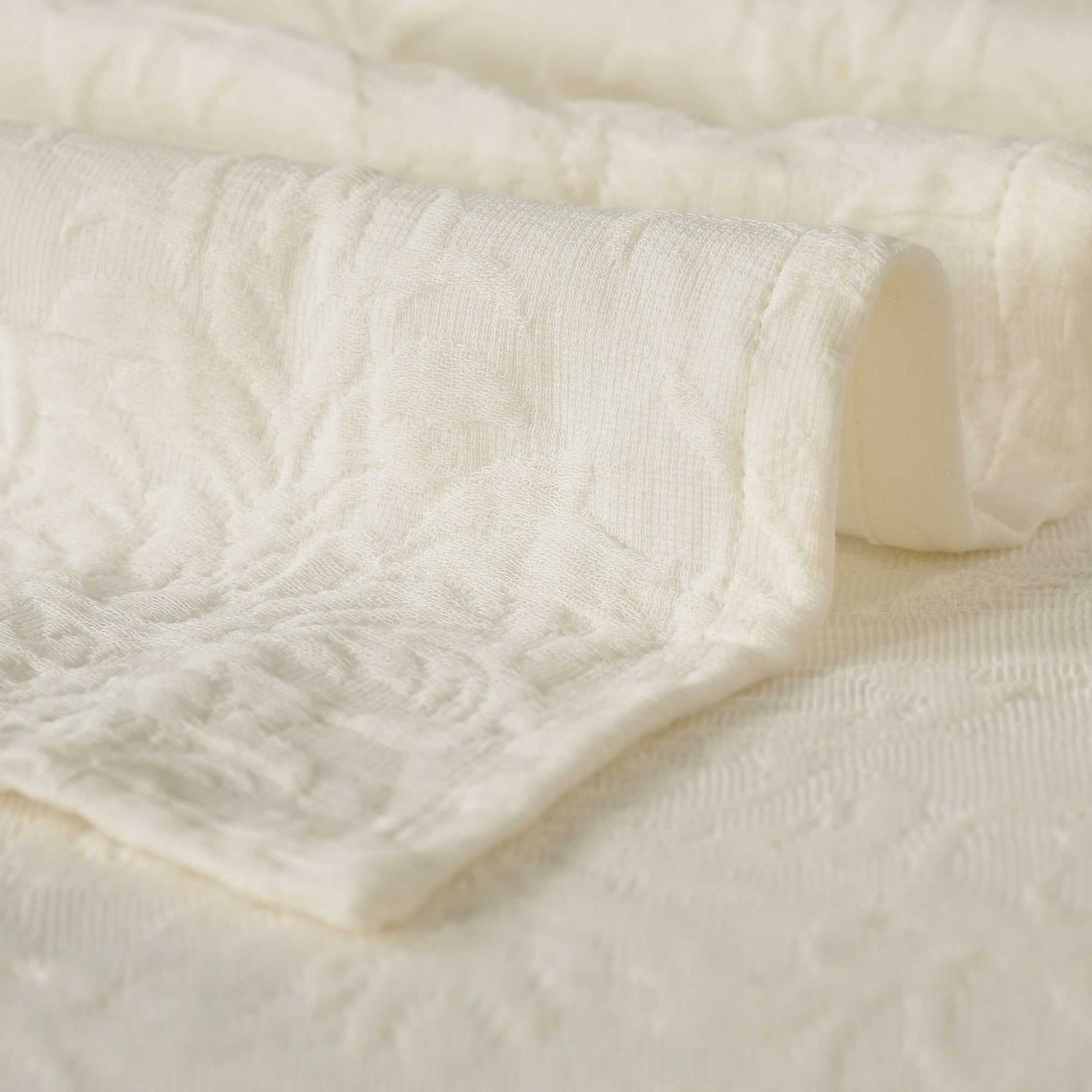 Close-up of the soft, textured cotton fabric of the Beautiful Blooms MatelassÃƒÂ¨ Bedcover. Includes two pillow shams.