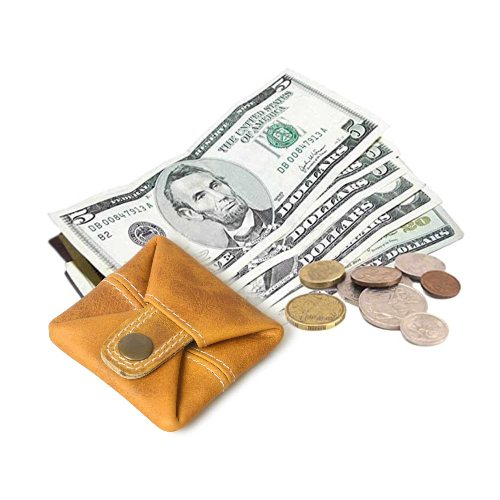 Mustard yellow full grain leather mini pocket wallet with cash and coins beside it.