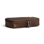 Stylish brown leather toiletry bag for men with a secure, water-resistant double zipper.