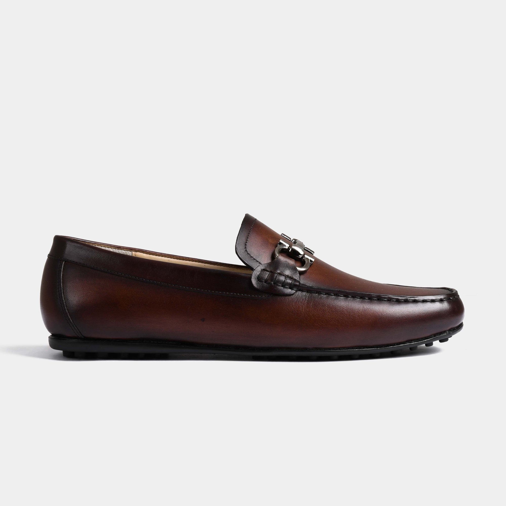 Side view of Helio Brown Leather Driving Loafers with a silver metal buckle accent.