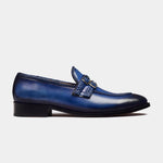 Jade blue leather loafers with double monk straps and a braided detail.