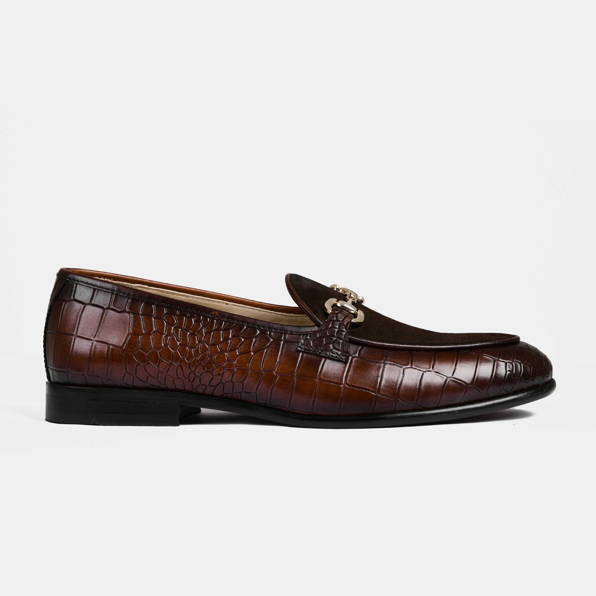 A pair of Azura Brown Leather Loafers with a crocodile skin texture and a gold buckle detail.