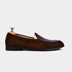 A pair of brown suede Arno Loafers with a textured leather strap across the top.