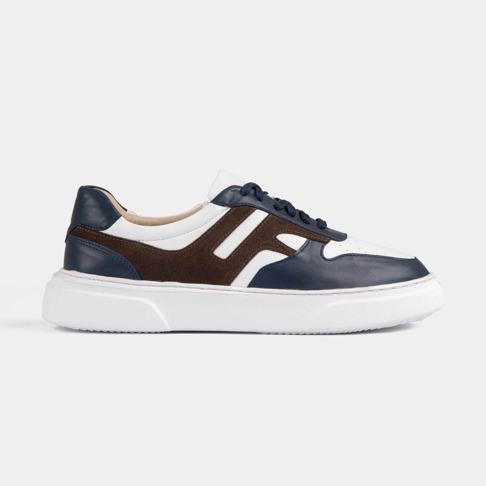 Pair of Classic Luxoro Lf Leather Sneakers in a stylish combination of navy, brown, and white.