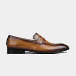 Side view of a single Lucero Walnut Leather Loafer, showcasing the rich brown leather and classic penny loafer design.