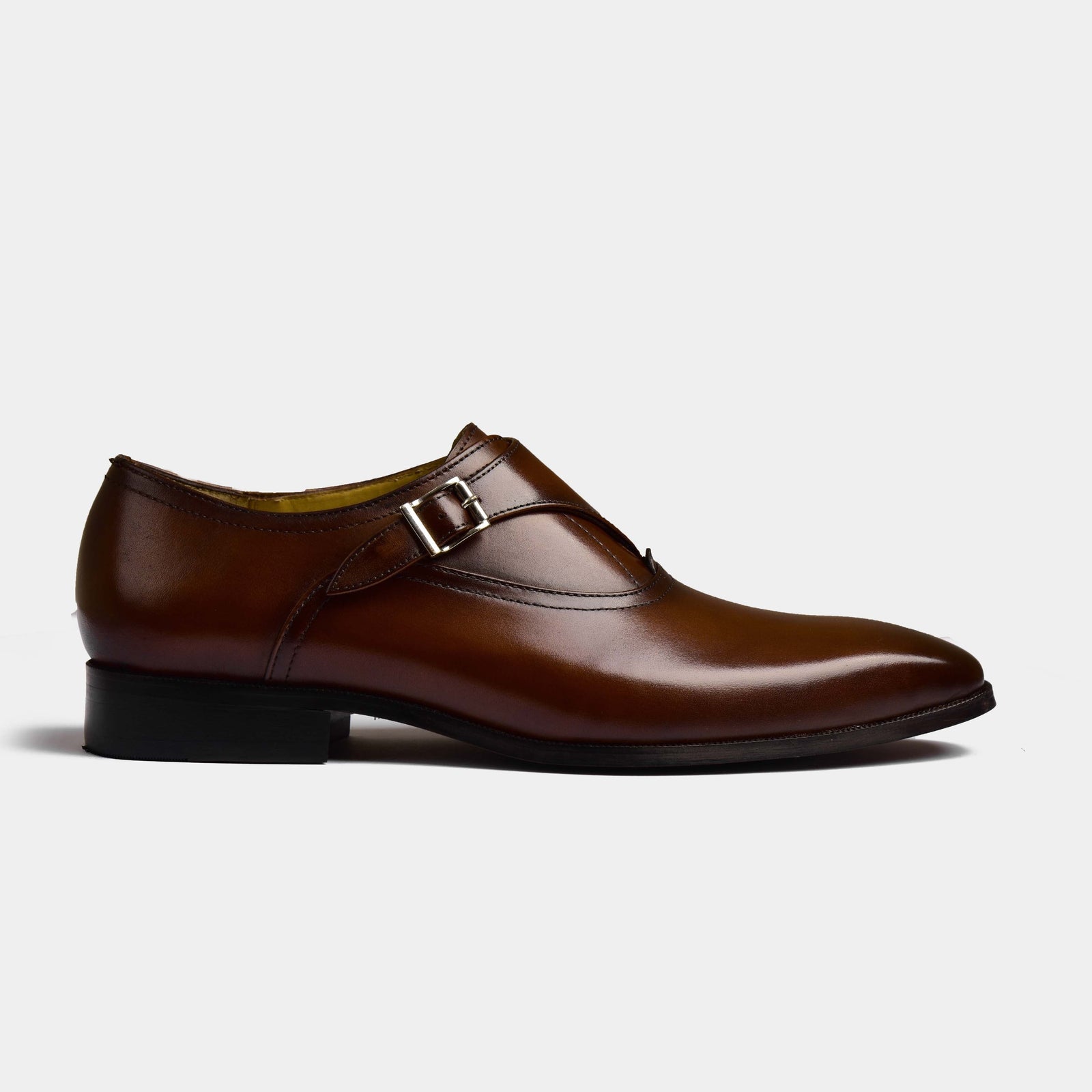 Side view of a brown leather Efron Choc Monk Strap shoe, showcasing its sleek design and single buckle closure.