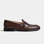 A pair of brown Arno Loafers, showcasing a handwoven, textured leather upper and classic penny loafer design.