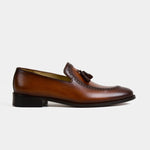 Side view of a brown Peter Norwan Leather Loafer with decorative stitching and tassel detail.