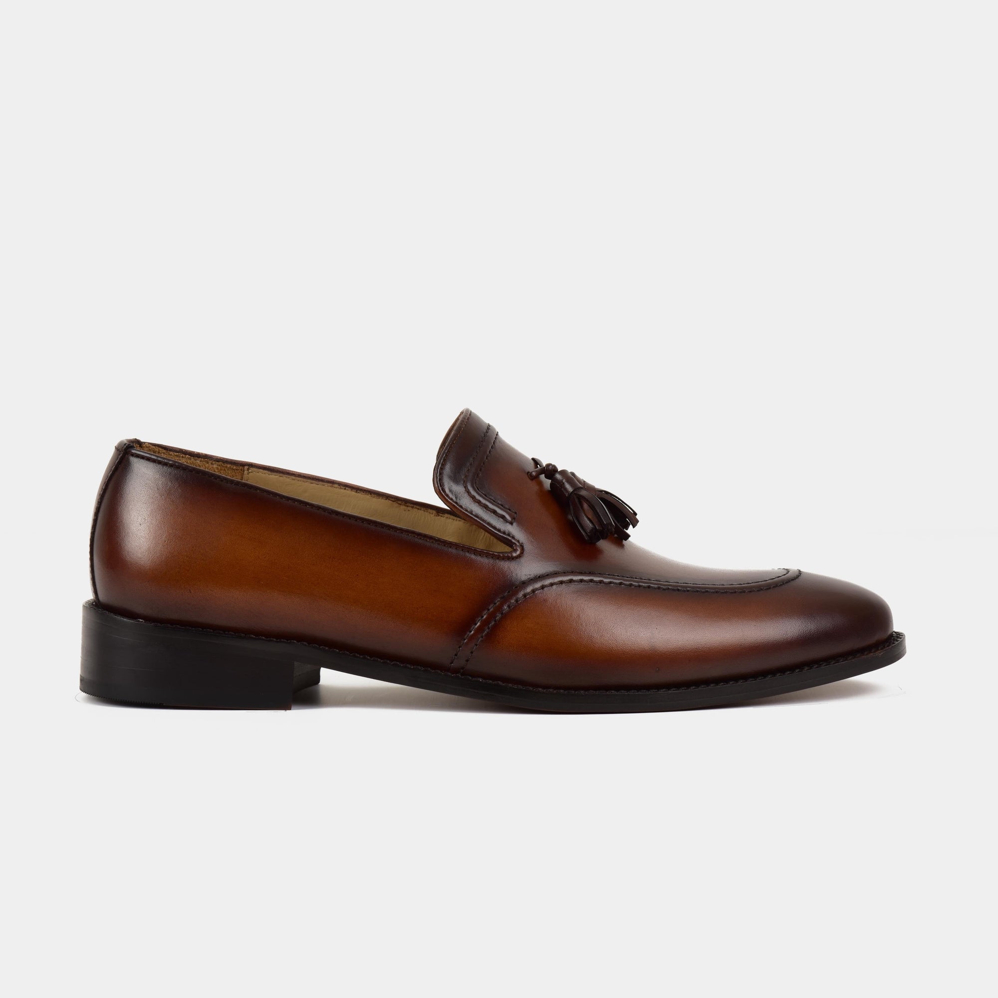 A pair of Jim Taylor Leather Loafers in brown, featuring a classic tassel detail and a sleek silhouette.