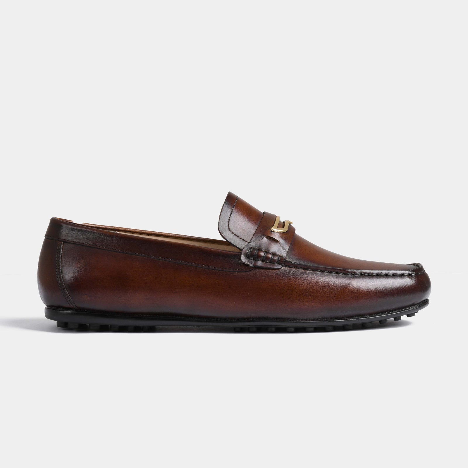 Side view of Cruz Brown Leather Driving Loafers with a gold metal accent on the strap.