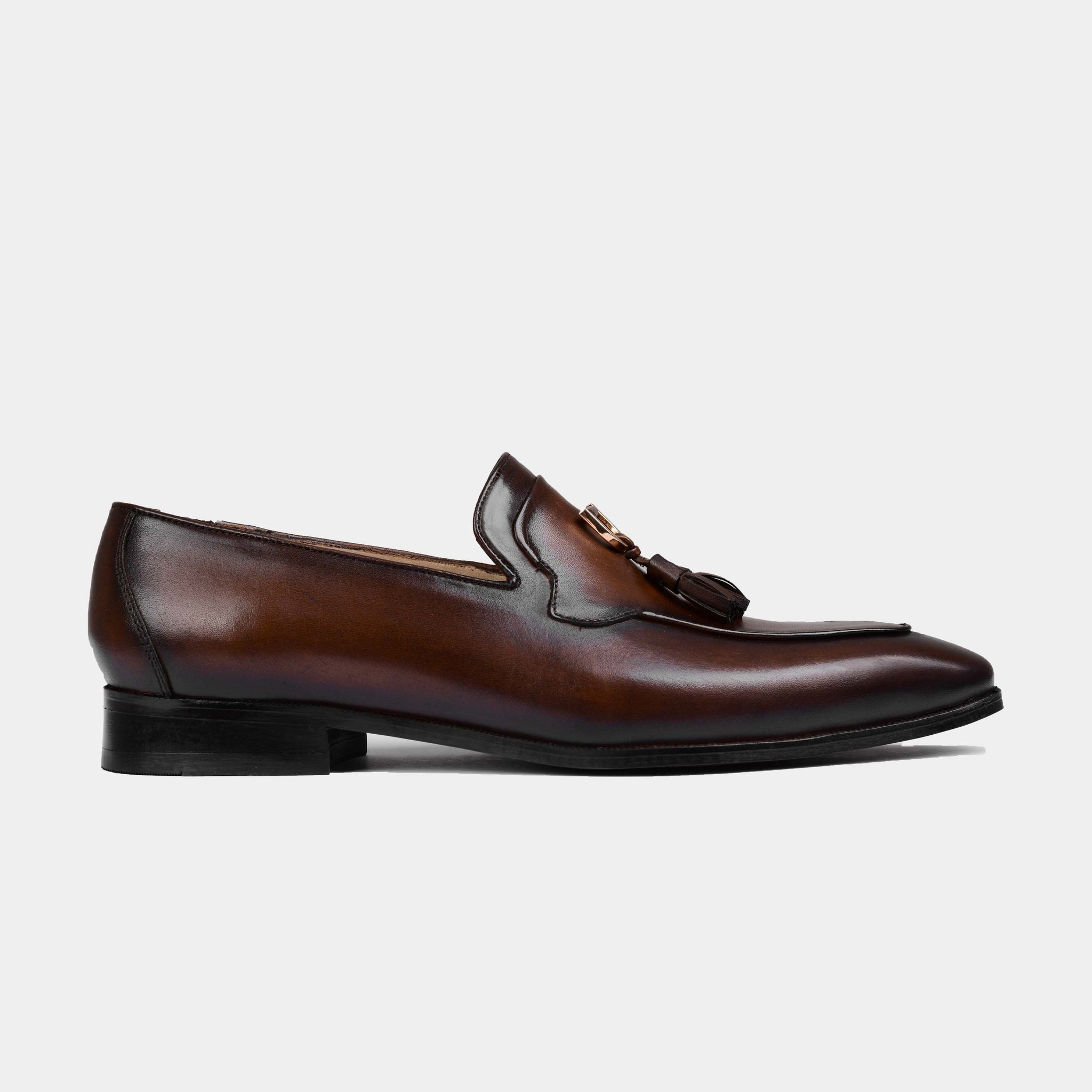 Atilio Brown Leather Loafers with tassel detail, shown in a side view.