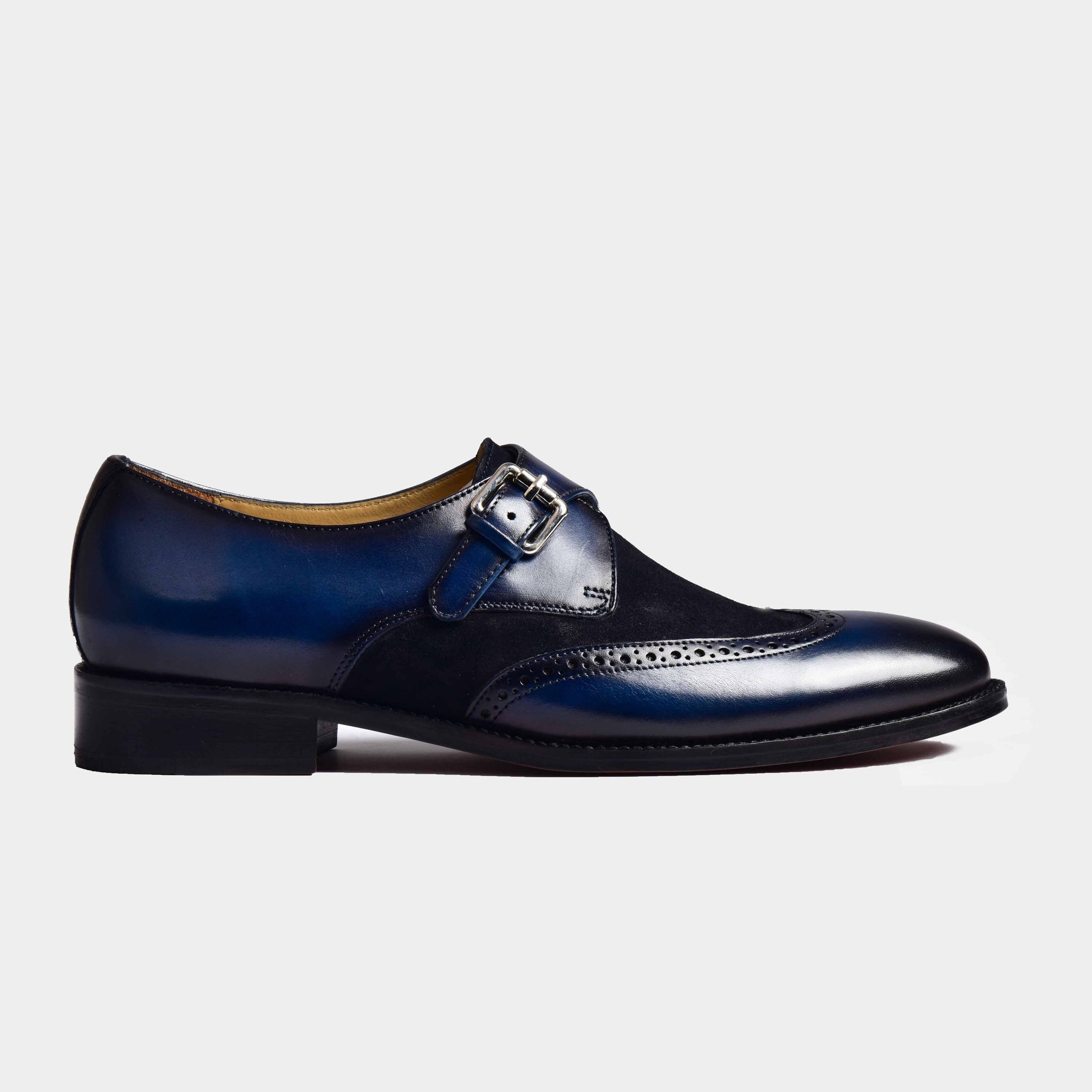 Stylish blue leather Bruce monk strap shoes with a single buckle and brogue detailing.