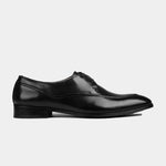 A side view of the Marcos Charcoal Lace Ups, showcasing the sleek black leather and classic lace-up design of these stylish men's dress shoes.