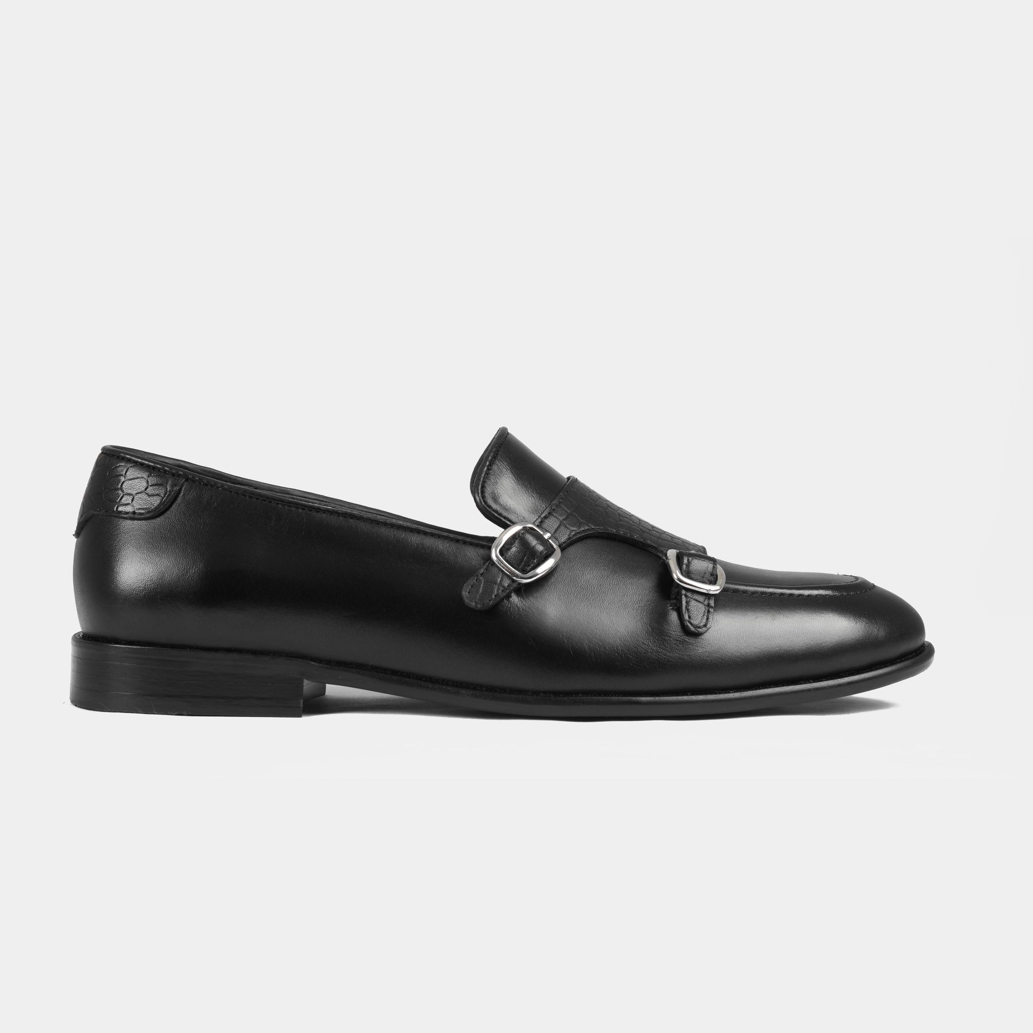 Pair of Armeo Black Leather Monk Straps shoes with a side view showcasing the double buckle closure.