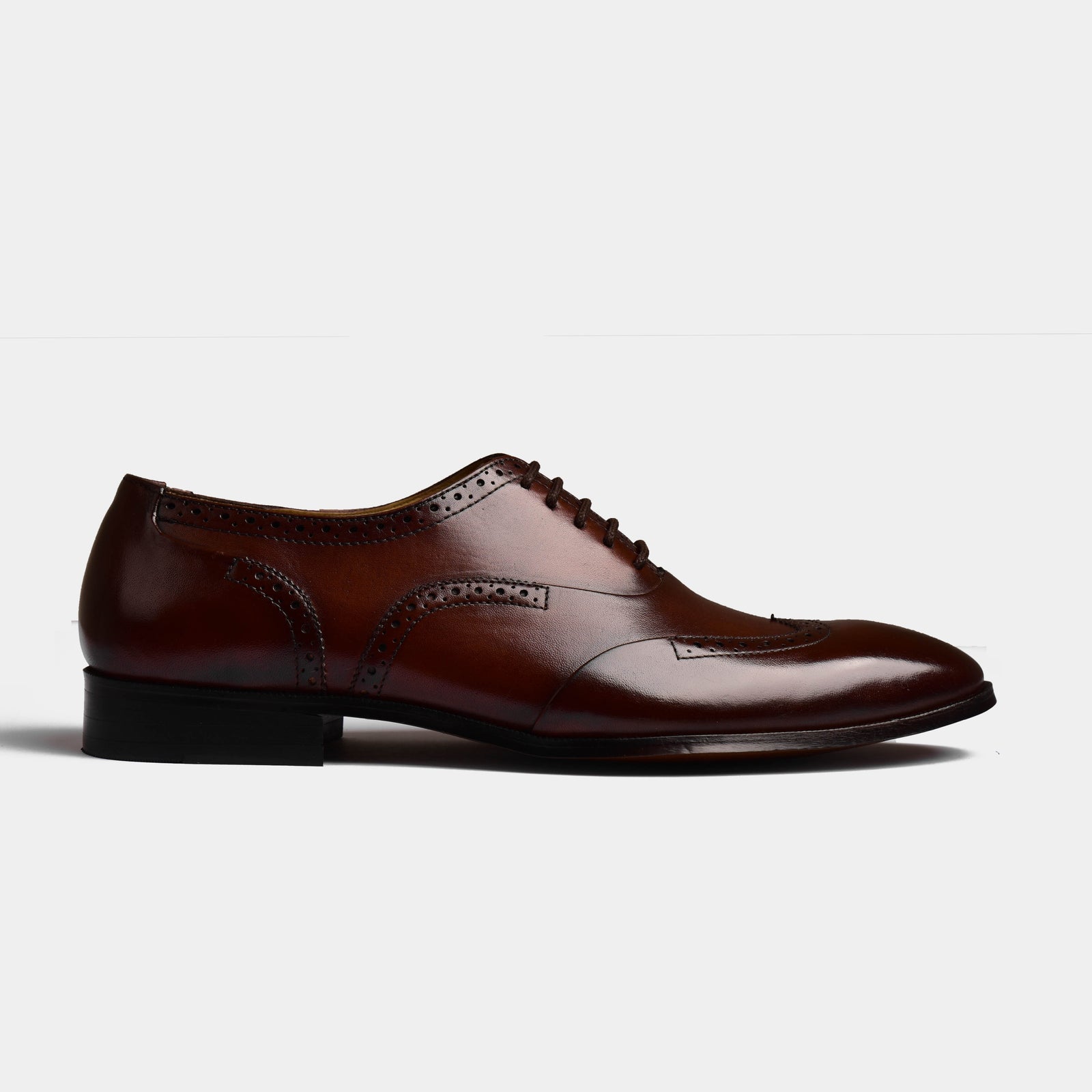 Side view of Kanor Tabaco Leather Laceups, showcasing the rich brown leather and detailed brogue design on these stylish men's dress shoes.