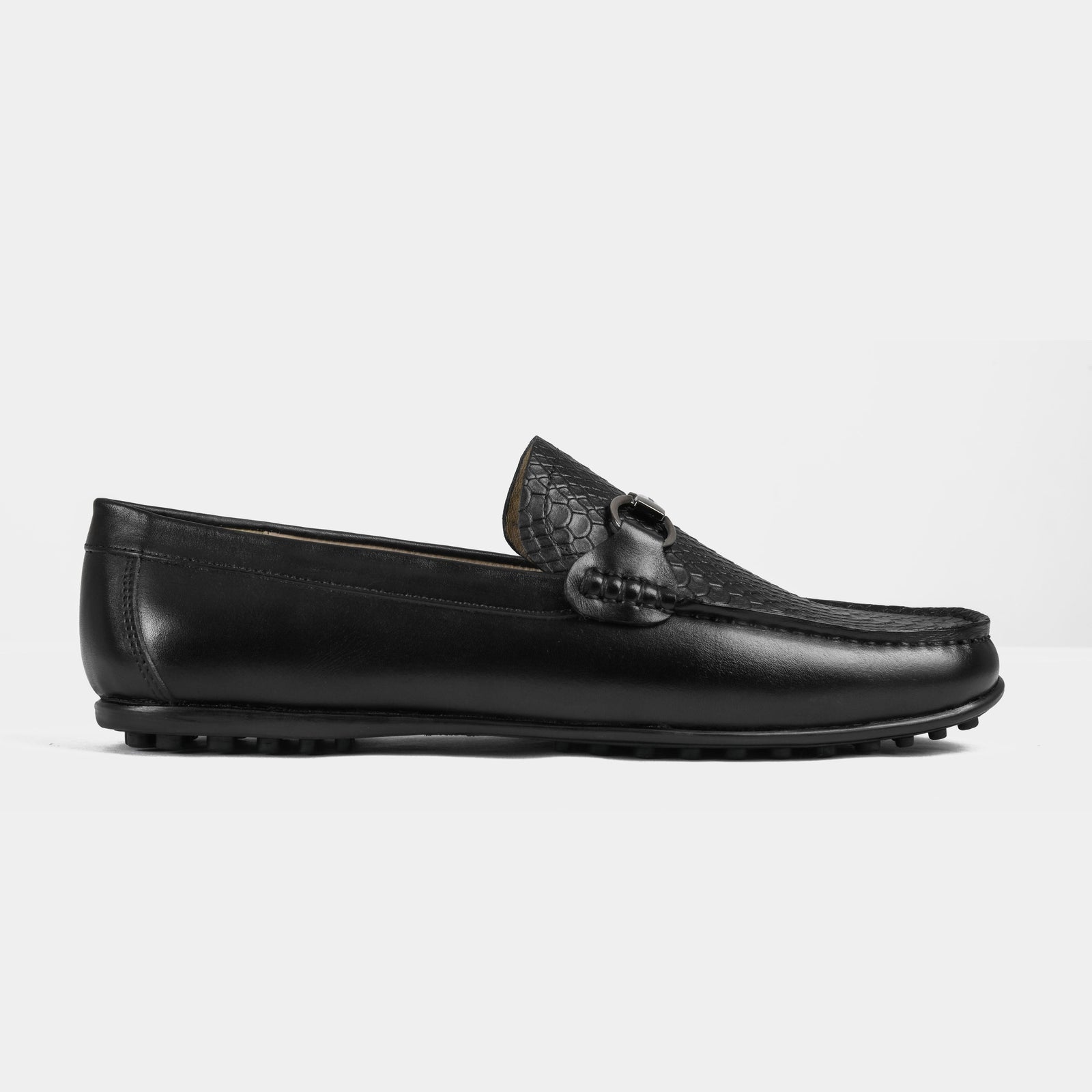 Pair of Matias Black Leather Driving Loafers with a textured vamp and metal accent.