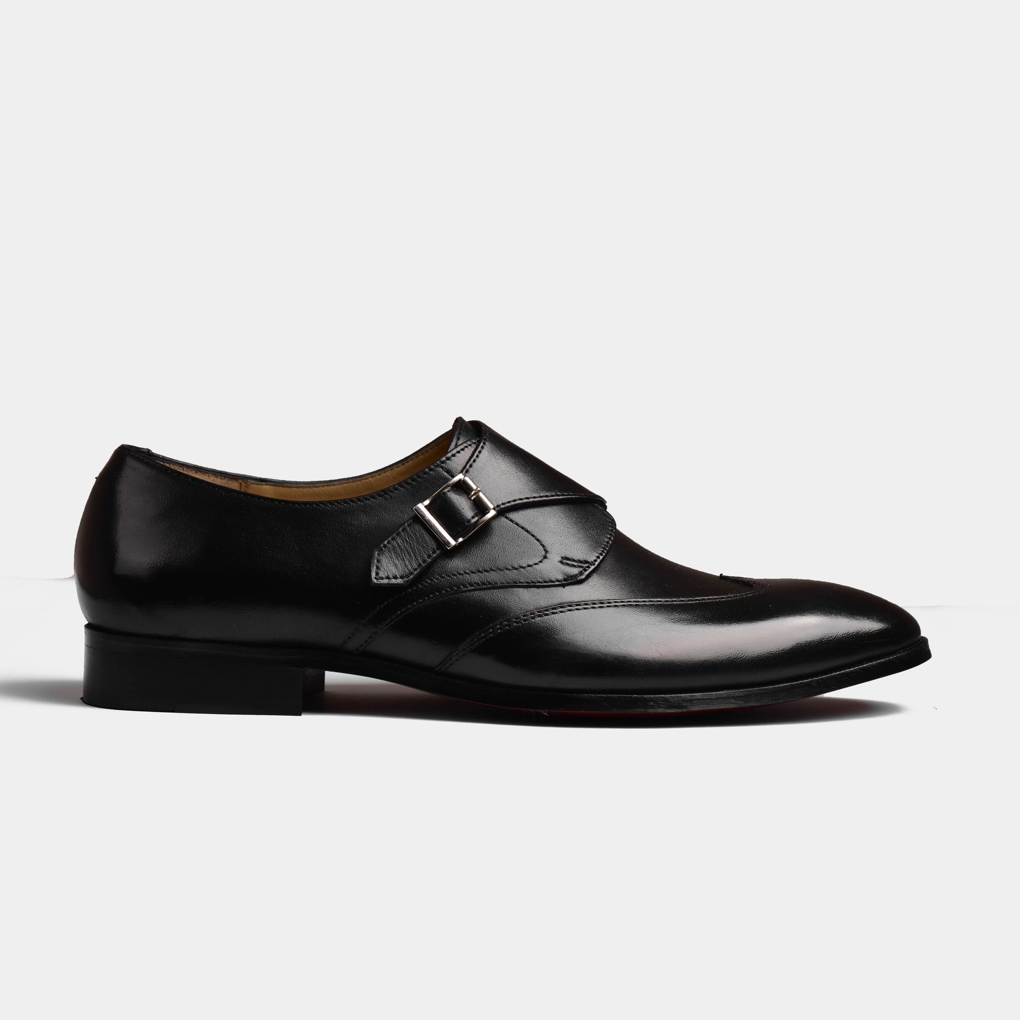 A pair of Garrett Black Leather Monk Straps with a single buckle closure on a white background.